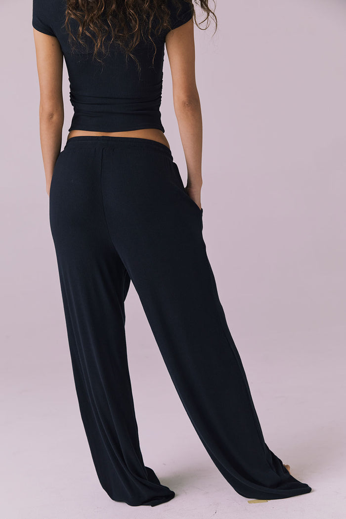 Chaser Sandyy Licorice Black Trouser back view highlighting smooth elastic waistband and relaxed lounge silhouette