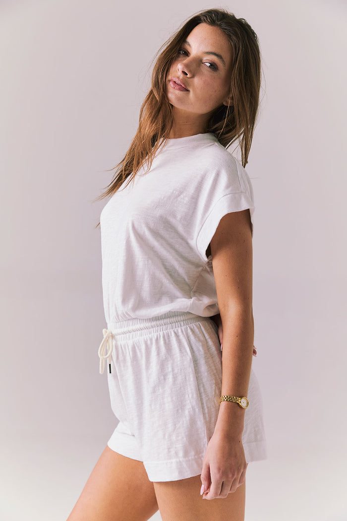 Side view of the Chaser Sanremo White Romper showing the elastic waist and soft drape