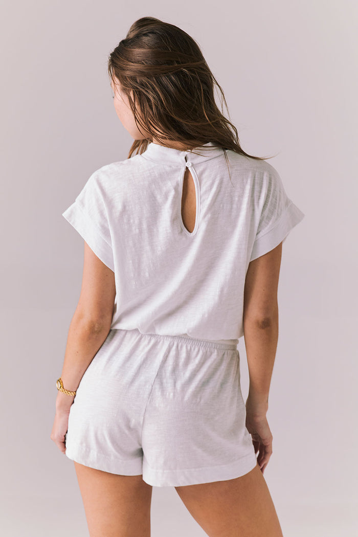 Back view of the Chaser Sanremo White Romper featuring the keyhole button closure and easy fit