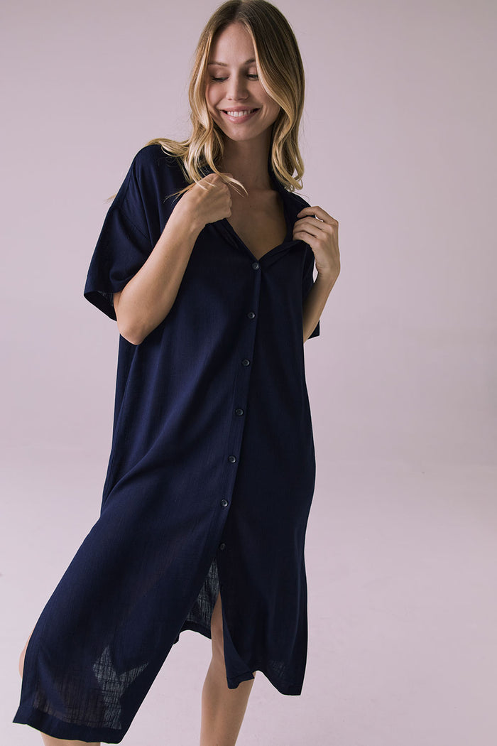 Full body front view of the Chaser Seaside Navy Button Up Dress with a soft open collar and laid back fit