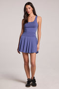 A full front view of a woman wearing the Chaser French Riviera Serve Mini Skort on a neutral background