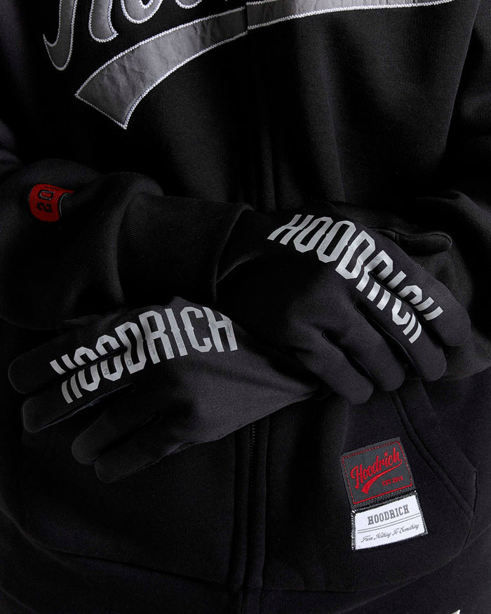 Black hoodie with 'Hoodrich' branding and matching gloves on a dark background