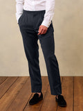 Shadow black linen tuxedo pants on model in white shirt, front waist-down view, hand in pocket