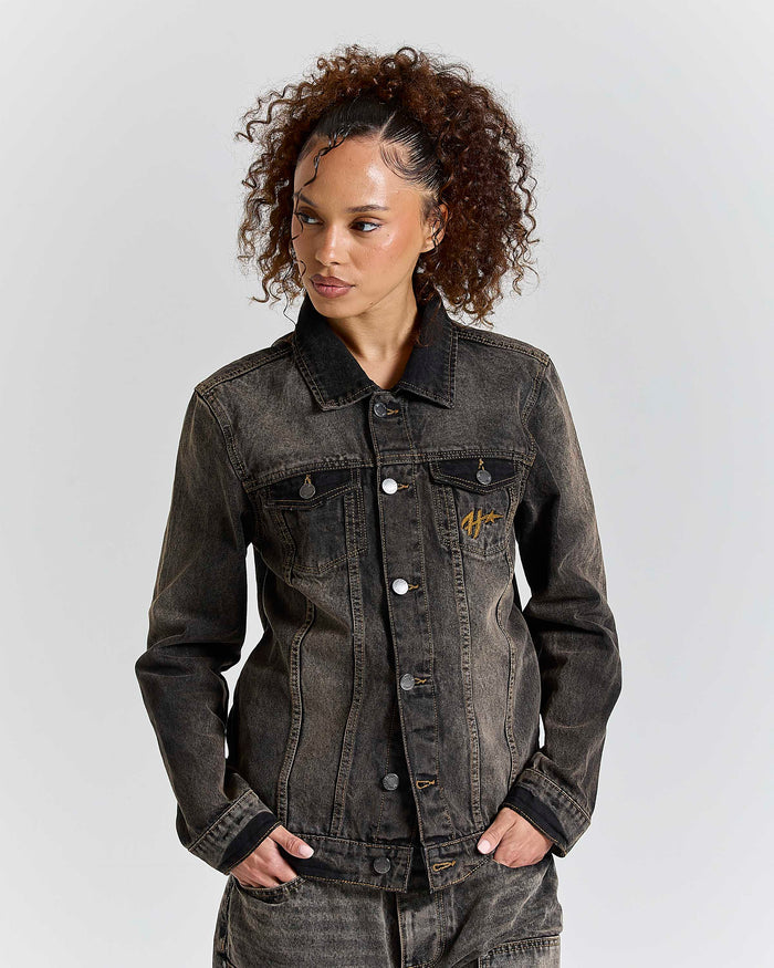 Model wearing a regular fit black rust washed denim jacket with Hoodrich logo embroidery on the chest pocket.