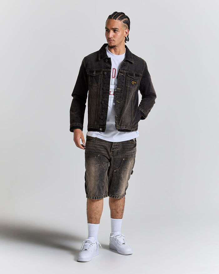 Model wearing a regular fit black rust washed denim jacket and matching jeans.