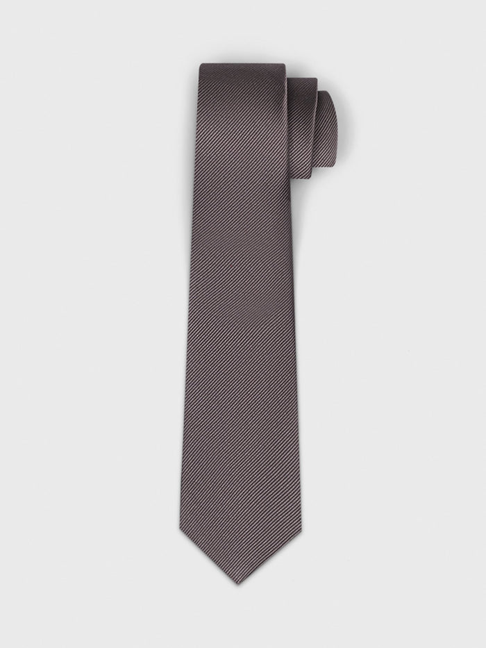 Mauve-grey silk tie, rolled, on light grey background