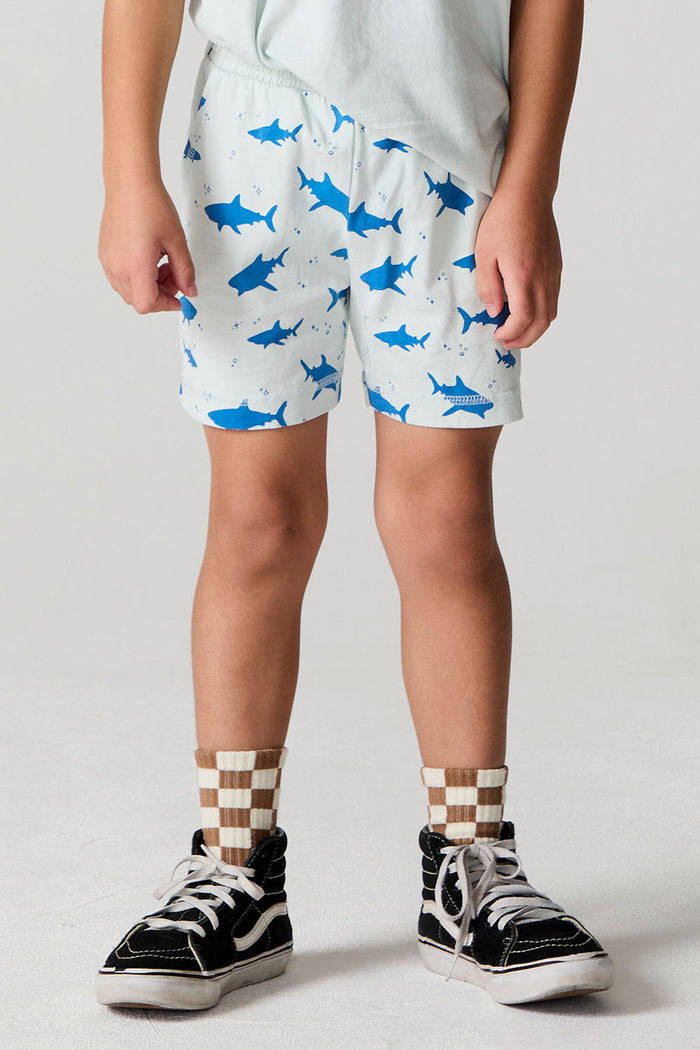 Front view of a boy wearing the Chaser Shark Around Shorts on a neutral background