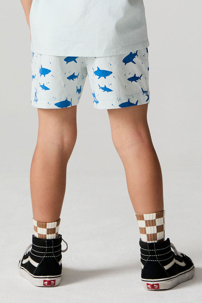 Back view of a boy wearing the Chaser Shark Around Shorts on a neutral background