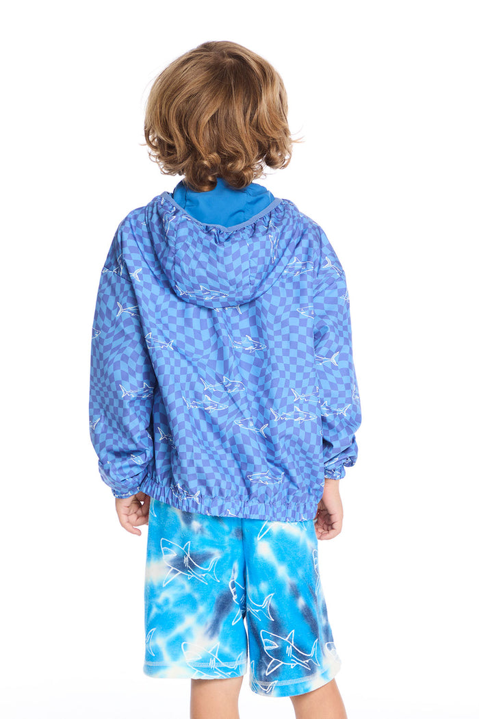 Back view of boy wearing the Chaser Kids Shark Check Zip Up Hoodie featuring full checkerboard shark print and elastic hem, paired with Shark Bite Shorts on a white background