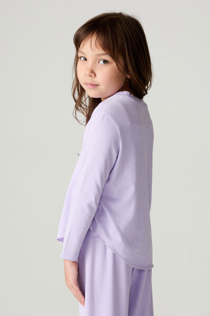 Back view of a girl  wearing the Chaser Shocking Love Girls Tee on a neutral background with matching shirt