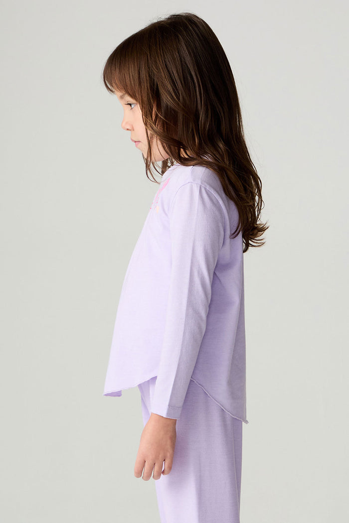 Side view of a girl wearing the Chaser Shocking Love Girls Tee on a neutral background with shirt