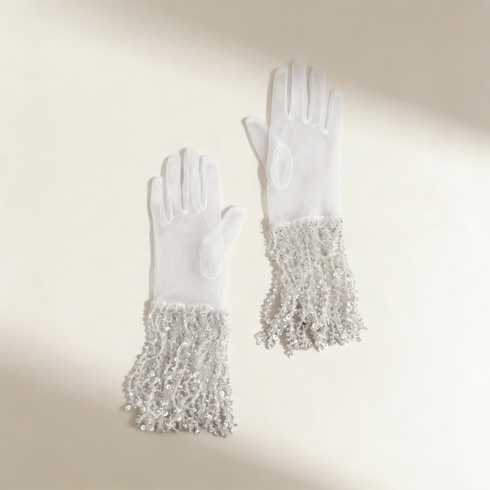 Luxury handmade wedding gloves featuring crystal sequin fringe details and elegant vintage bridal accessory design.