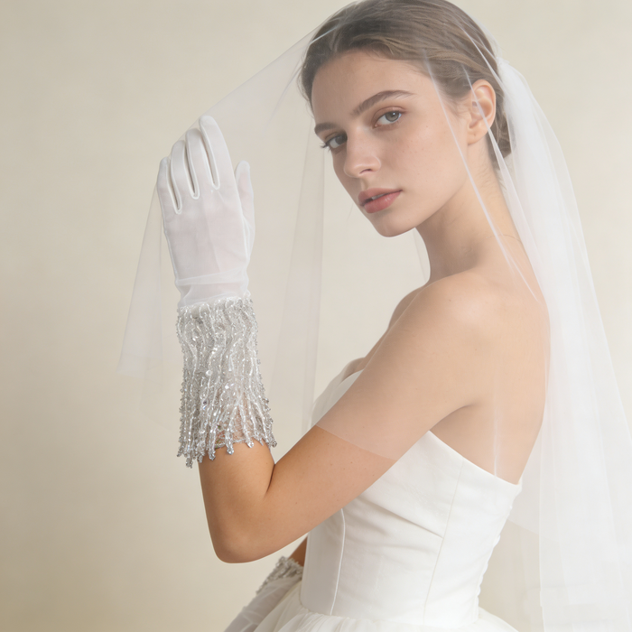 Luxury handmade wedding gloves featuring crystal sequin fringe details and elegant vintage bridal accessory design.