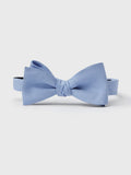 Sky blue linen silk bow tie, tied, on light grey background