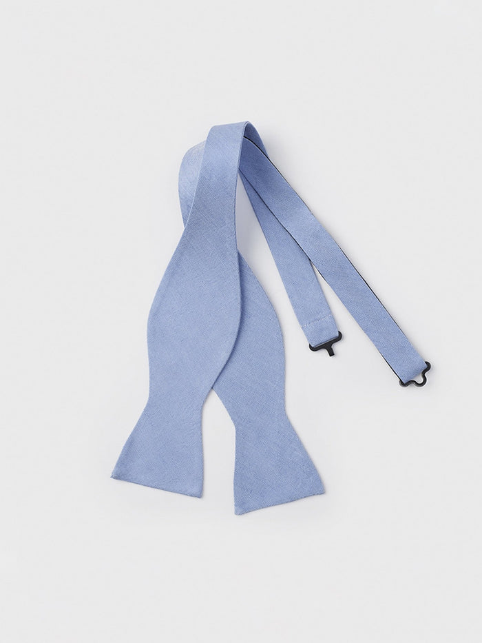 Sky blue linen-silk self-tie bow tie, untied and laid flat
