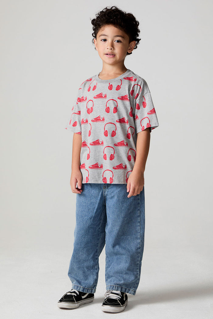Full body front view of a boy wearing the Chaser Sneaks and Headphones Tee on a neutral background