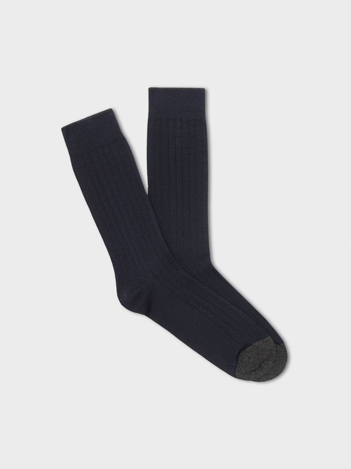 Pair of navy ribbed dress socks with charcoal toe, folded flat on light grey background