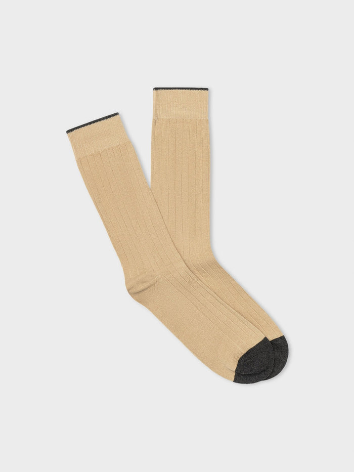 Pair of tan ribbed dress socks with charcoal toe, folded flat on light grey background