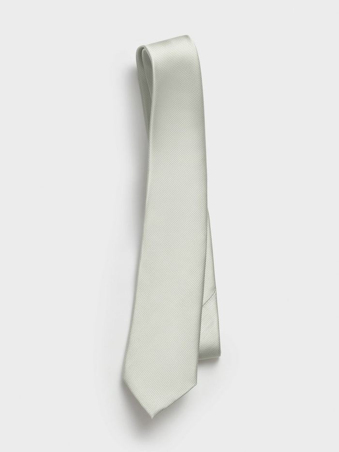 Spearmint silk tie with twill texture, draped against a white background
