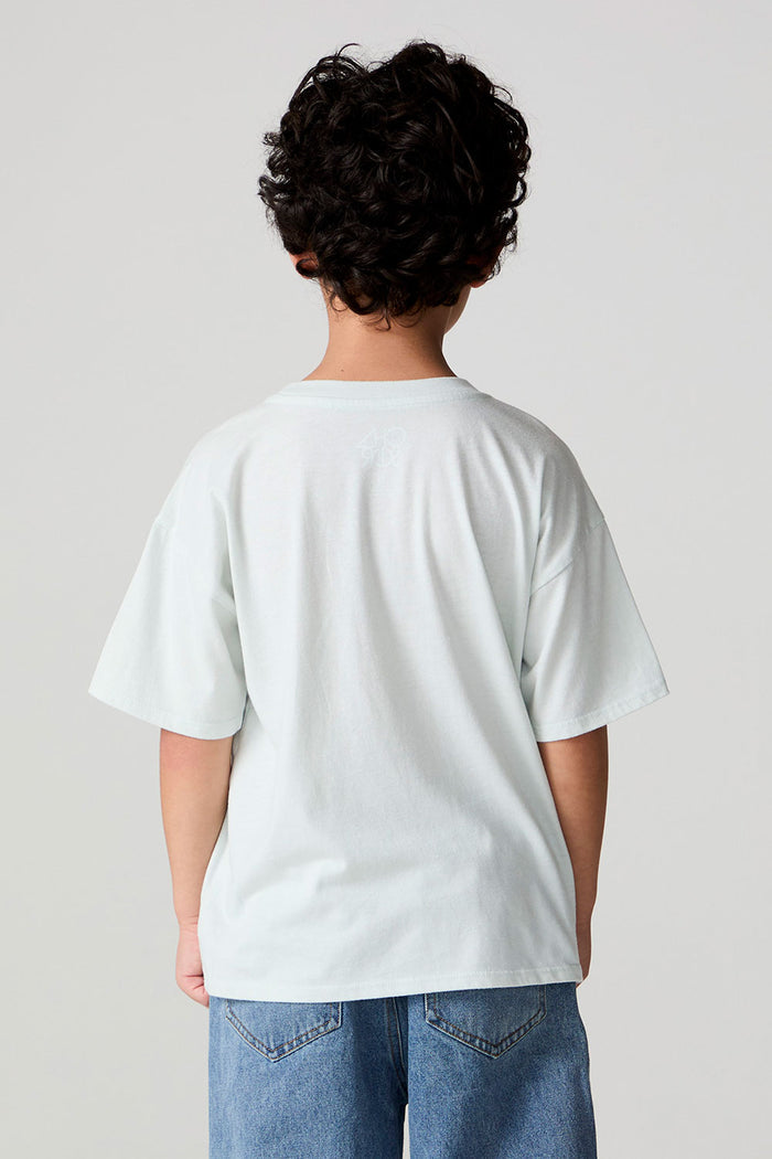 Back view of a boy wearing the Chaser Speedway Tee on a neutral background