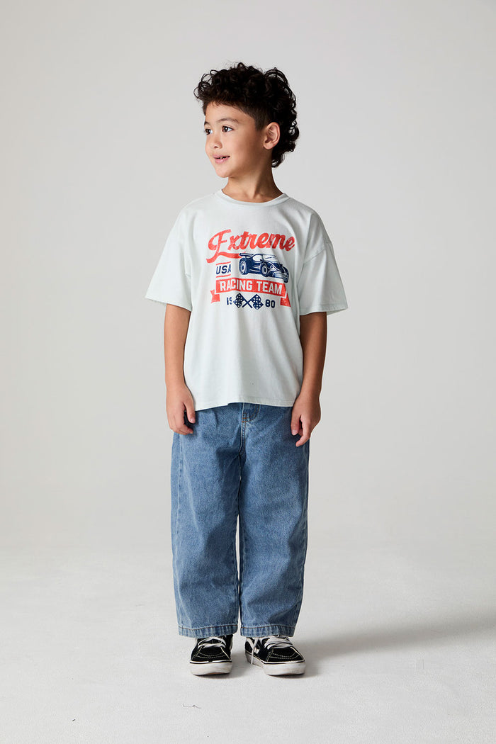 Full body view of a boy wearing the Chaser Speedway Tee on a neutral background
