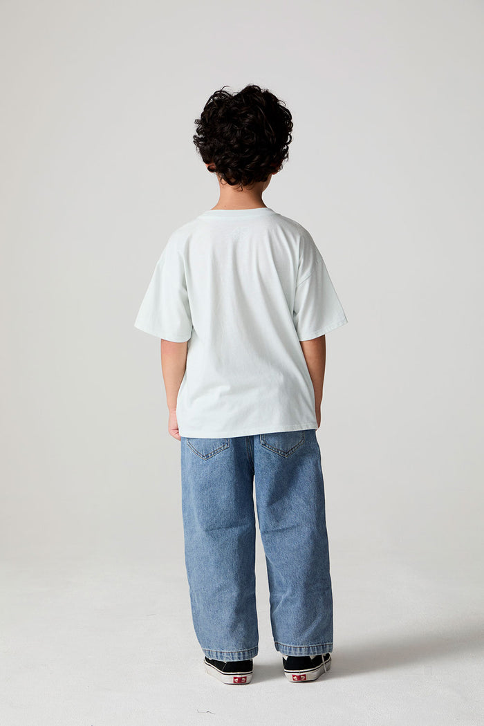 Full body back view of a boy wearing the Chaser Speedway Tee on a neutral background