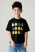 Front view of a boy wearing the Chaser Spooky Friends Boys Tee on a neutral background with baggy bluejeans