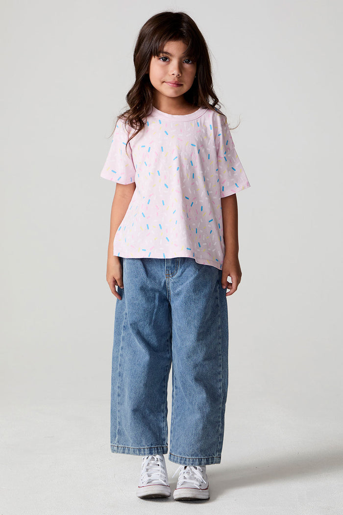 Full body front view of a girl wearing the Chaser Sprinkle Party Tee on a neutral background
