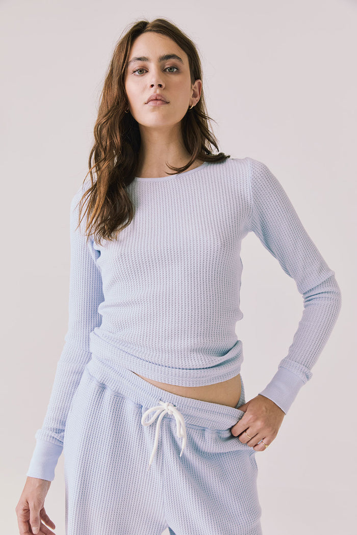 Front view of woman wearing Chaser’s Spritz Long Sleeve on a white background