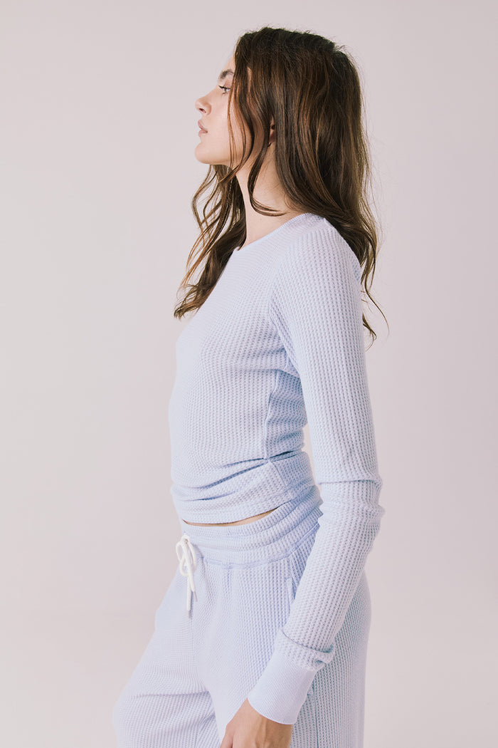 Side view of woman wearing Chaser’s Spritz Long Sleeve on a white background