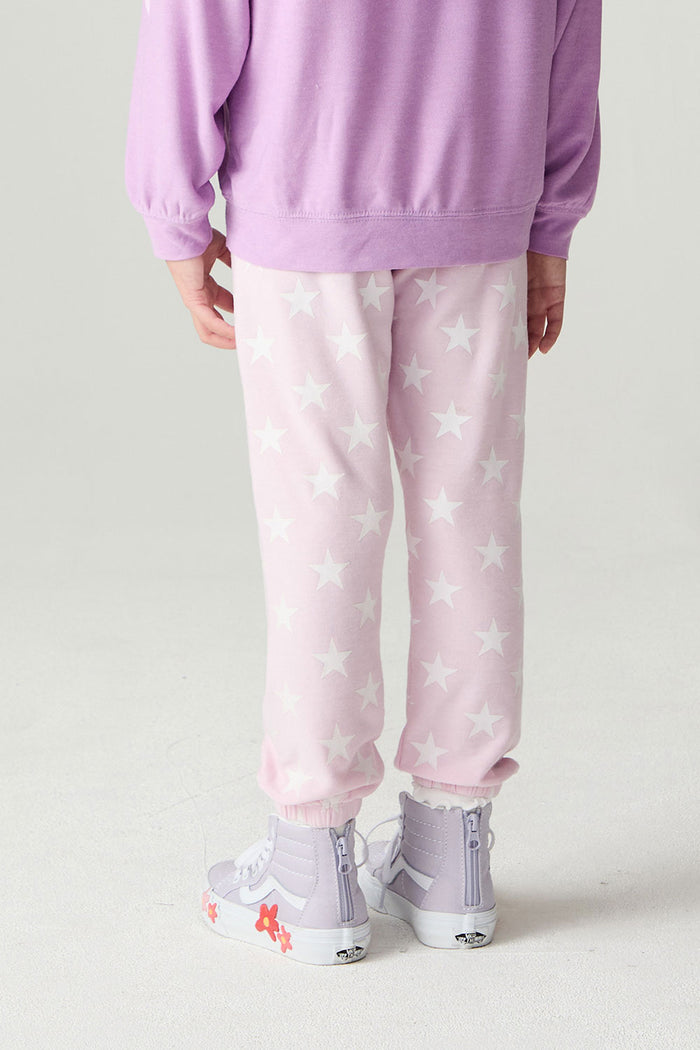 Back view of a girl wearing the Chaser Stars Allover Girls Jogger on a neutral background