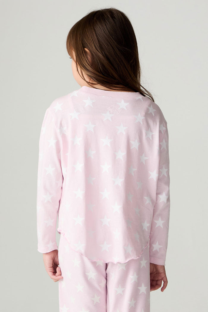 Back view of a girl wearing the Chaser Stars Allover Girls Tee on a neutral background with top