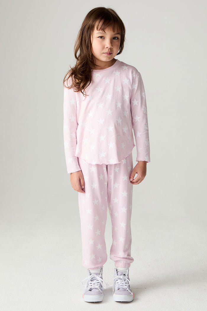 A full body front view of a girl wearing the Chaser Stars Allover Girls Tee on a neutral background