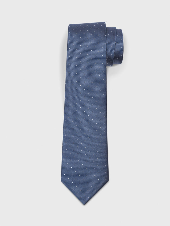 Steel blue silk tie with white pindot pattern, rolled, on light grey background