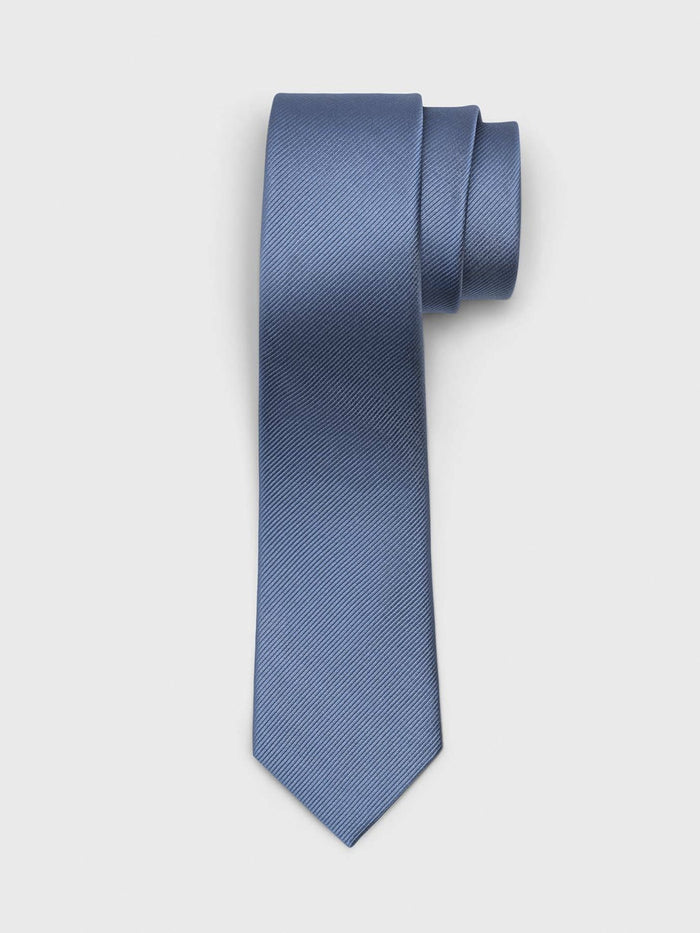 Steel blue silk tie with twill texture, rolled at top on light grey background