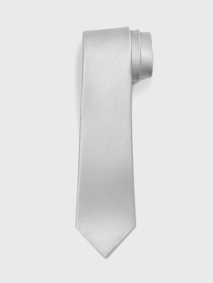 Sterling silk tie with twill texture, rolled at top on light grey background