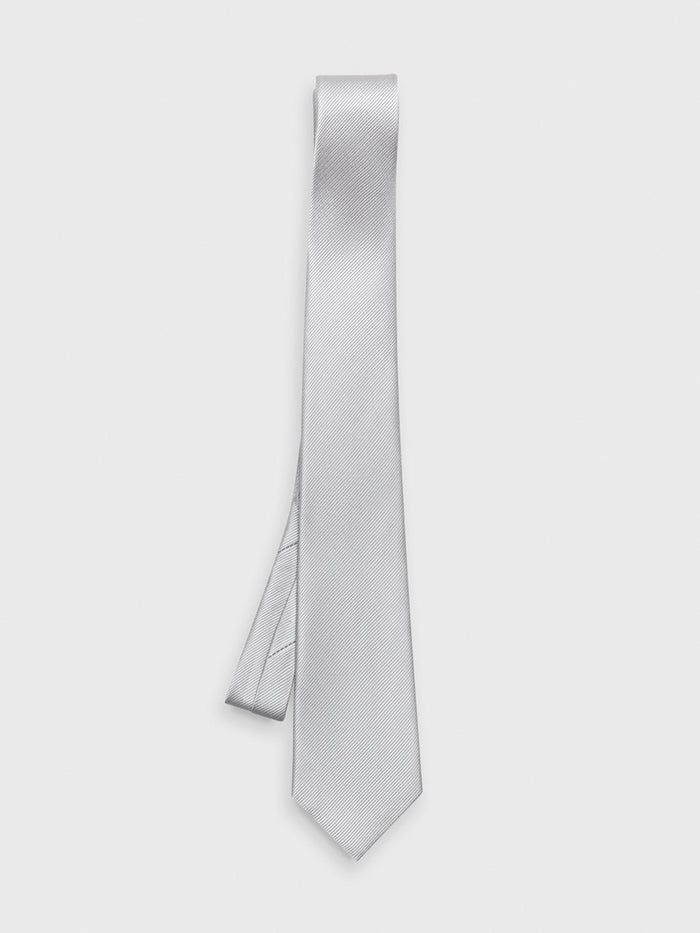 Sterling silk tie hanging straight with folded loop at top on light grey background