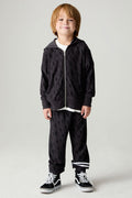 Full body front view of a boy wearing the Chaser Storm Boys Jogger on a neutral background with a matching sweatshirt