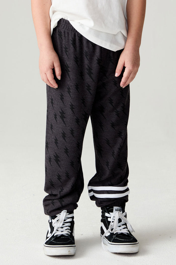 Front view of a boy wearing the Chaser Storm Boys Jogger on a neutral background with a white tee