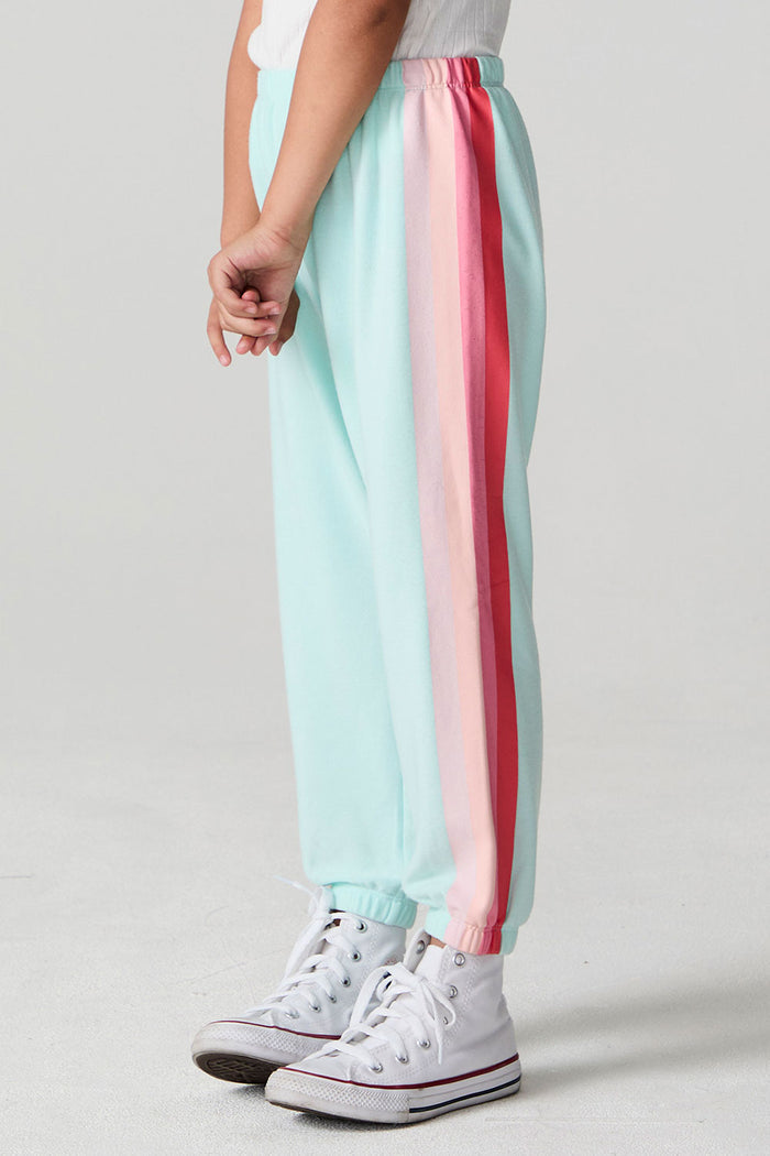 Side view of a girl wearing the Chaser   Stripes for Days Pants on a neutral background