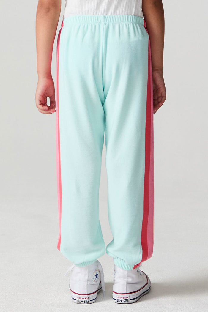 Back view of a girl wearing the Chaser   Stripes for Days Pants on a neutral background