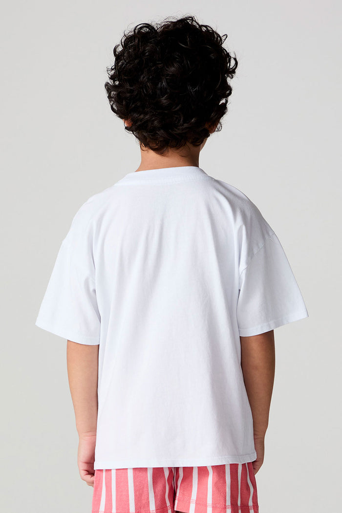 Back view of a boy wearing the Chaser Sunglass Pop Tee  on a neutral background