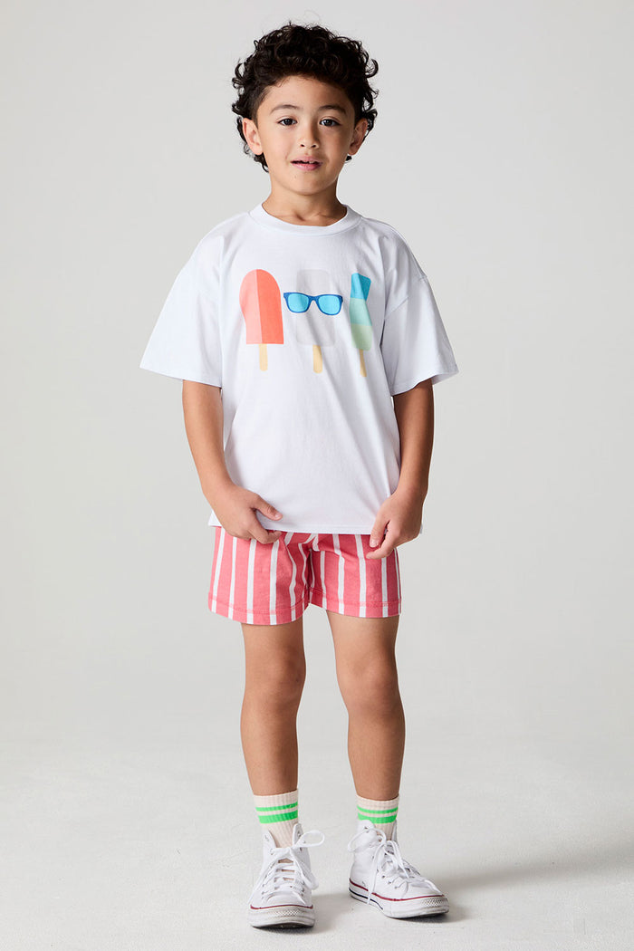 Full body front view of a boy wearing the Chaser Sunglass Pop Tee  on a neutral background