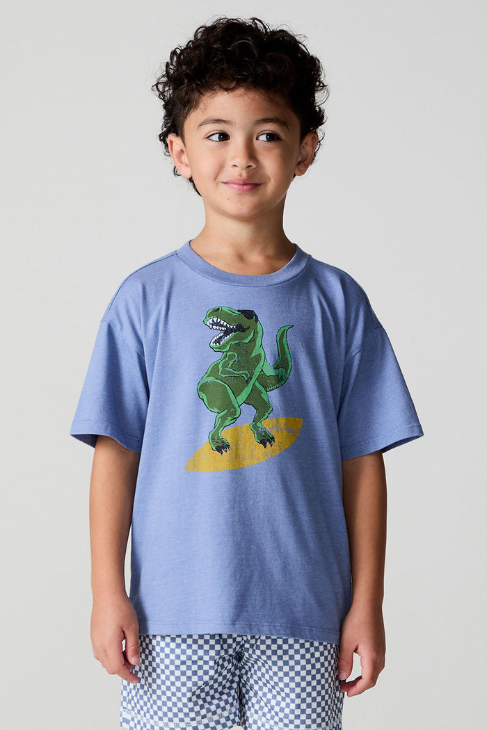 Front view of a boy wearing the Chaser Surfin T-Rex Tee on a neutral background