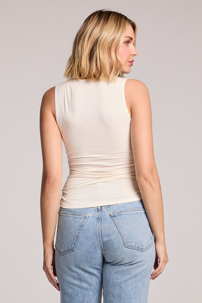 Back view of a woman wearing the Chaser Coconut Milk Sweetheart Tank Top on a neutral background
