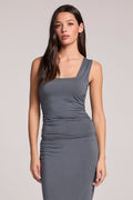 Side angle view of a woman wearing the Chaser Future Grey Sweetheart Tank and matching midi skirt on a neutral background