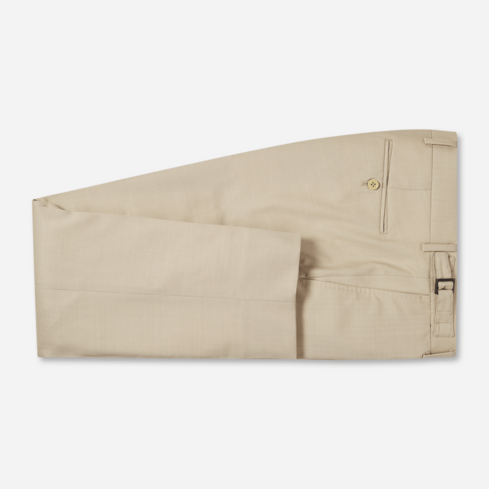 Tan suit trousers, flat lay, folded with pressed crease and belt loops