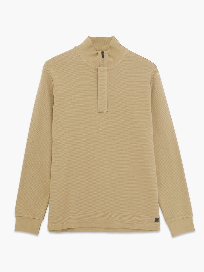 A woman wearing a taupe ottoman texture Sweatshirt with long sleeves, a funnel neckline, a branded half zip and a regular fit.