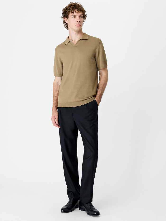 A man wearing a taupe knit Polo shirt
with short sleeves, a trophy collar and a regular fit.
