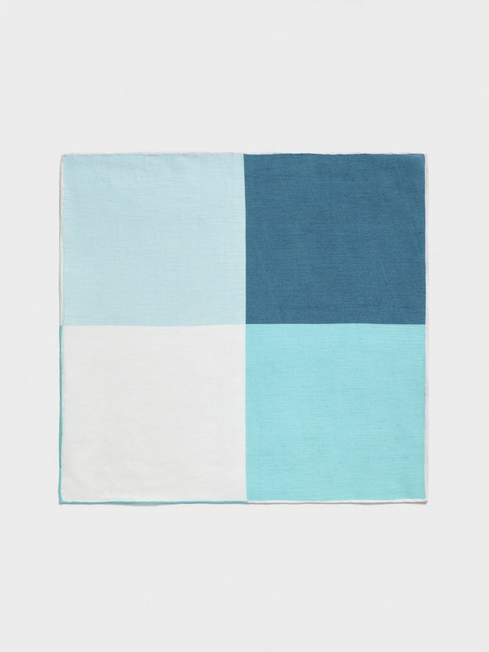 Teal, light blue, and white color-block pocket square, folded flat